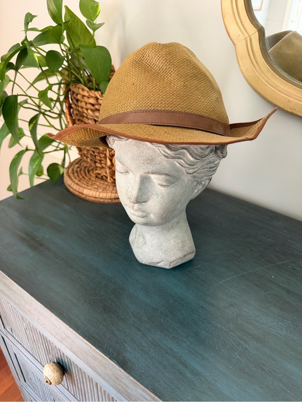 Brixton tan woven straw fedora hat is styled with a sleek brown leather band